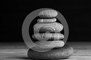 Zen sculpture. Harmony and balance, cairn, poise stones on wooden table