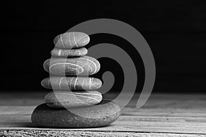 Zen sculpture. Harmony and balance, cairn, poise stones on wooden table