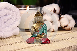 Zen spa still life with a buddha statue, towels and candle stock photo images