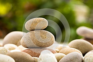 Zen stacked stones on nature background