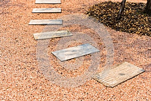 Zen stone path on gravel floor in the garden