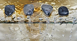 Zen stone pebble water drops