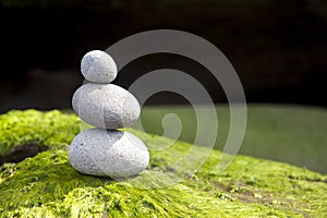Zen stone rack tower on green surface