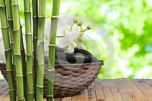 Zen stones and bamboo on wooden table