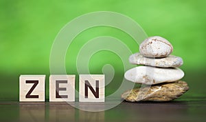 Zen stones on green background