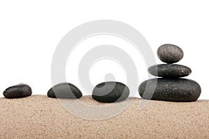 Zen stones pyramid on sand beach, meditation, concentration, relaxation, harmony, balance