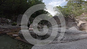 Zen stones in quiet river lake