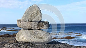 Zen stones on a rock near the atlantic ocean