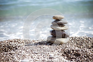 Zen stones on sea shore, symbol of buddhism