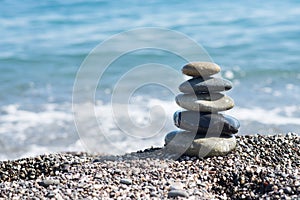 Zen stones on sea shore, symbol of buddhism