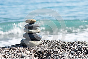 Zen stones on sea shore, symbol of buddhism