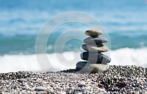 Zen stones on sea shore, symbol of buddhism