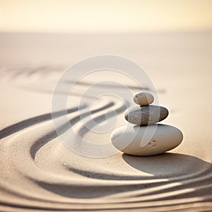 Zen stones stack on raked sand waves in a minimalist setting for balance and harmony