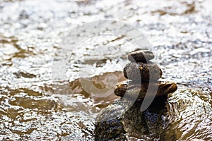 The Zen stones are stacked on the riverside. Zen stone background.