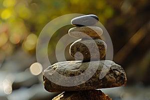 Zen stones stacked in a tranquil nature setting