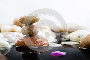 Zen Stones stacked with water reflection