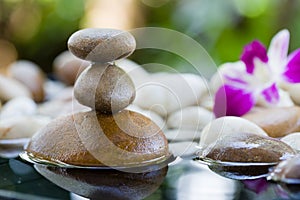 Zen Stones stacked with water reflection