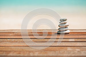 Balanced several Zen stones on blurred beautiful the beach background