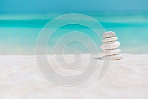 Balanced several Zen stones on blurred beautiful the beach background