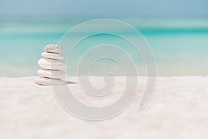 Balanced several Zen stones on blurred beautiful the beach background