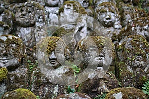 Zen style buddha stone with the growing moss in japan at Otagi nenbutsuji