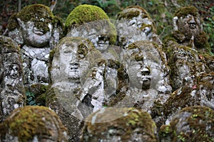 Zen style buddha stone with the growing moss in japan at Otagi nenbutsuji