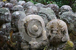 Zen style buddha stone with the growing moss in japan at Otagi nenbutsuji