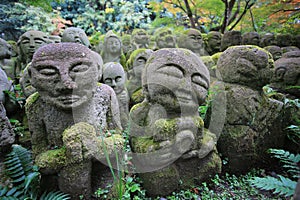 Zen style buddha stone with the growing moss in japan at Otagi nenbutsuji