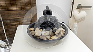 zen water fountain on top of a small white table