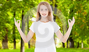 Zen woman isolated on park background, meditation and buddhism concept