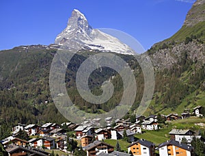 Zermatt famous ski and hiking resort with chalets and Matterhorn on the background