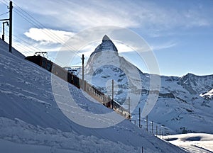 Zermatt Matterhorn glacier sunset view with railway mountain winter snow landscape Swiss Alps light