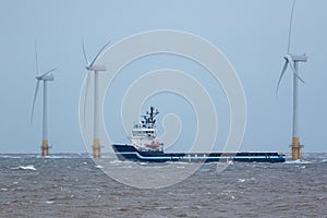 Zero carbon emission electricty production. Supply ship between wind turbines