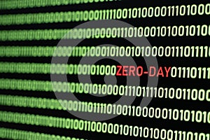 ZERO-DAY text and binary code concept from the desktop computer screen.