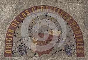 Zero kilometer brass plaque on Puerta del Sol square in Madrid, Spain photo