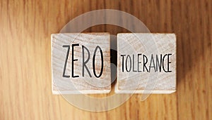 Zero tolerance - words from wooden blocks with letters, severely punishing all unacceptable behaviour, zero tolerance concept,