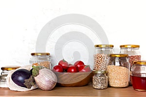 Zero waste bio food storage and shopping concept - groceries in textile bags,glass jars, wooden bowl. Eco friendly