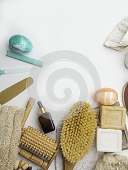 Zero waste concept. Eco-friendly bath set. Brushes, soap, serum, towel, stones, massage tools, nailfile photo