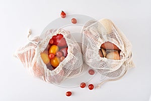 Zero waste concept. Fresh organic vegetables in textile bag on a white background