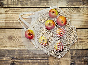 Zero waste concept, reusable mesh shopping bags.Eco-bag made of natural cotton fabric on a wooden background
