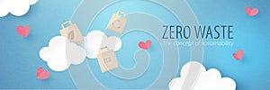 Zero Waste concept.Reusrable paper bag floating on blue sky with clouds and hearts.Paper art of conservation and sustainable