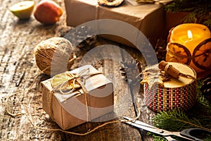 Zero waste and eco friendly christmas concept flat lay with gift, branches and candle on rustic wooden background