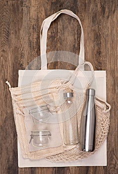 Zero waste eco friendly objects such as reusable linen shopping bags and glass jars