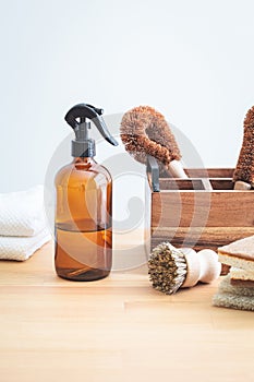 Zero waste eco products and tools for kitchen cleaning. Wooden brushes, coconut sponges, spray vinegar, lemon and organic soap,