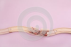 Zero waste. Eco wooden toys on pink background. Top view