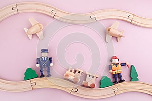 Zero waste. Frame from eco wooden toys on pink background. Flat lay. Top view