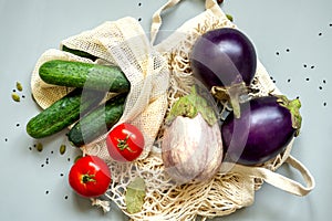 Zero waste healthy food-cereals, seeds, vegetables flat lay on grey background. Groceries in textile bags,glass jars