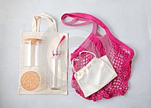 Zero waste kit. Mesh cotton bag, reusable glass containers and water bottle. Sustainable, ethical shopping, plastic free concept