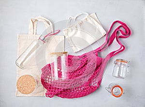 Zero waste kit. Mesh cotton bag, reusable glass containers and water bottle. Sustainable, ethical shopping, plastic free concept