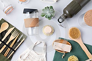 Zero waste kit. Set of eco friendly bamboo cutlery, mesh cotton bag, reusable coffee tumbler, brushes, bar soap and water bottle.